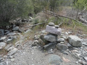Rock cairn markers, known as "ducks" have been left by prior hikers alongside the Prairie Fork trail between Mine Gulch & Cabin Flat campgrounds.  The trail is nearly non-existent in most places.