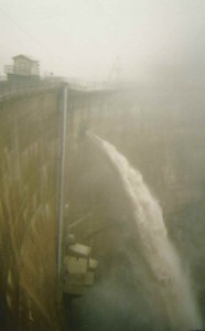 This is a scene of the Big Santa Anita Canyon Dam, located just north of Arcadia, at maximum spill way. Over 1,700 cubic feet of water per second was running through and over the dam the day this photo was taken.